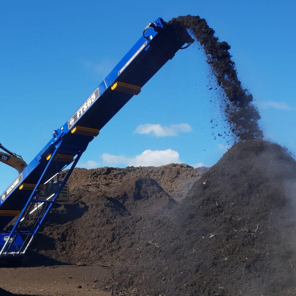 Bulk material being loaded into a pile
